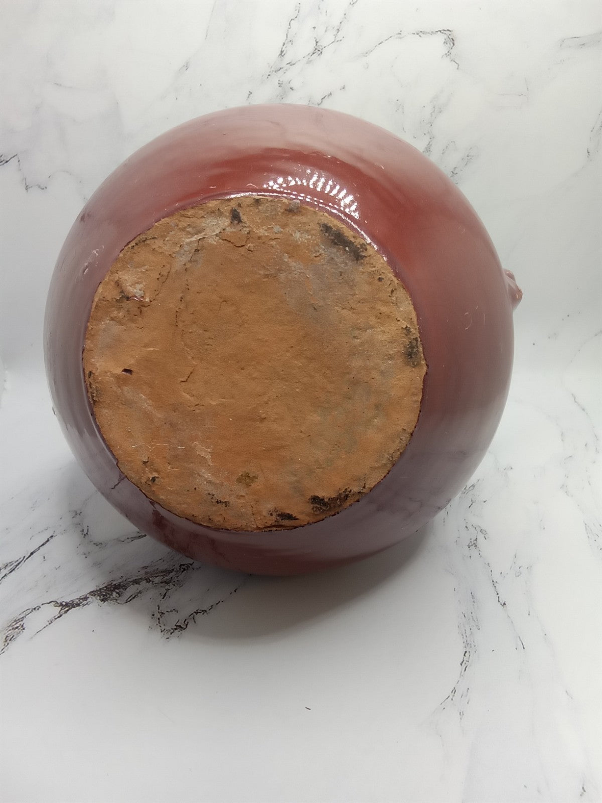 small, handled pot, likely a vintage bean pot possibly glazed Terracotta