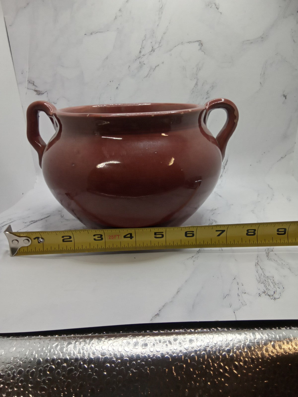 small, handled pot, likely a vintage bean pot  possibly glazed Terracotta
