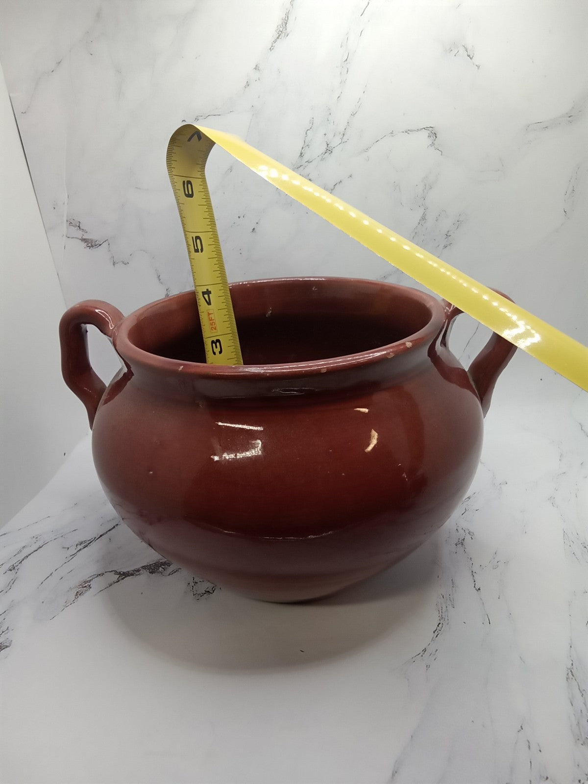 small, handled pot, likely a vintage bean pot  possibly glazed Terracotta