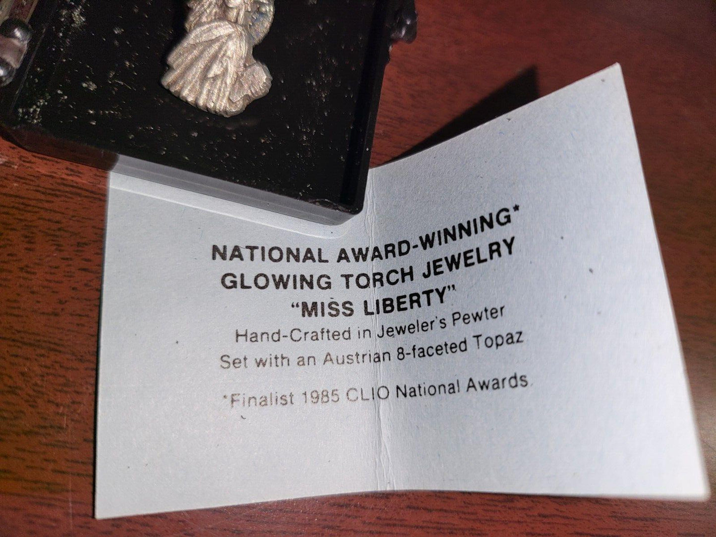 Miss Liberty Glowing Torch Jewelry Pin Pewter & Topaz 1.25" NOS CLIO  1985  #86